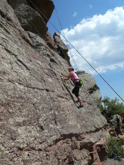Anita climbing a conglomerate face at Duncan Ridge.