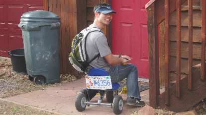 Felix Wong on a tricycle with Indiana license plates