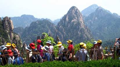 A tour group with colorful hats in the Huangshan Mountains.