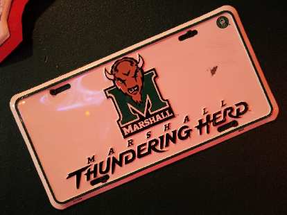 A Marshall Thundering Herd license plate inside Fat Patty's.