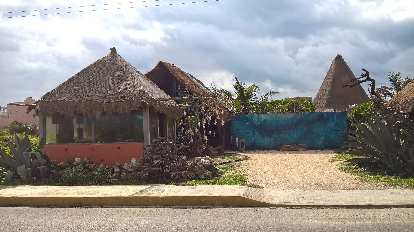 A house with a straw roof on Isla Mujeres. house, straw roof, Isla Mujeres