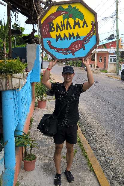 Felix Wong in front of Bahama Mama, a restaurant we ate at on Isla Mujeres. Bahama Mama sign, Felix Wong, Isla Mujeres