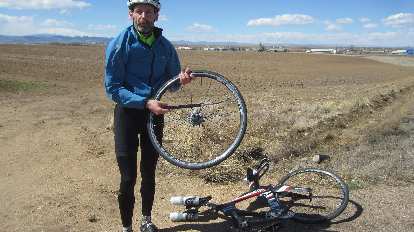 With only about five miles to go, I encountered a cyclist named Scott who got a flat tire. I lent him some tire irons. With only about five miles to go, I encountered a cyclist named Scott who got a flat tire. I lent him some tire irons.