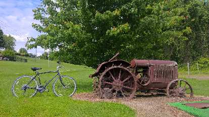 Rental bike and old tractor.