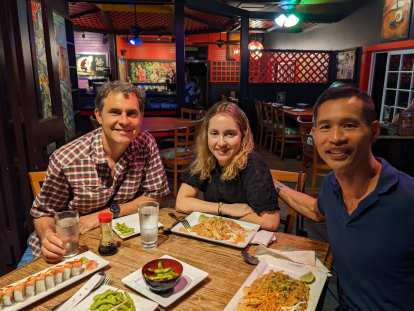 Dave, Andrea, and Felix having dinner at Bangkok Happy Bowl Thai Bistro in Poipu.