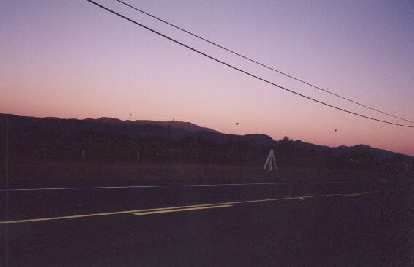 Balloons, wineries, and mountains lit by a pinkish sunrise. Balloons, wineries, and mountains lit by a pinkish sunrise.