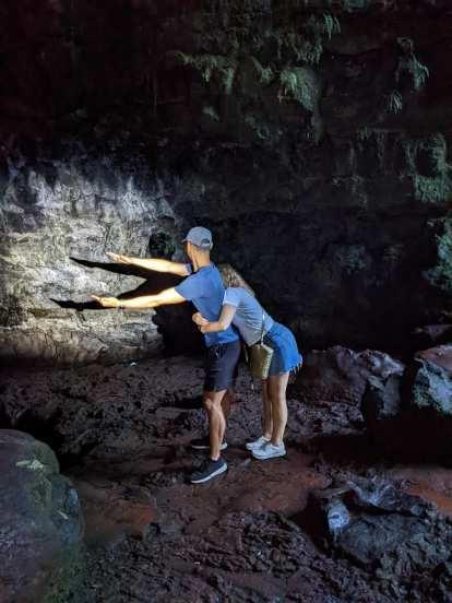 Felix and Andrea making an alligator shadow in Kaumana Cave.