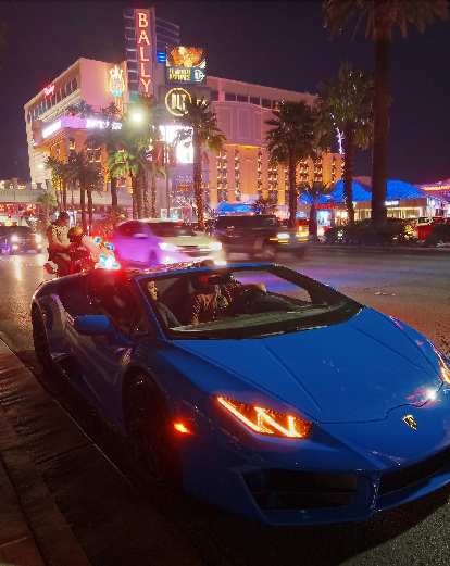 The driver of this blue Lamborghini Gallardo Spyder got pulled over by a police officer.