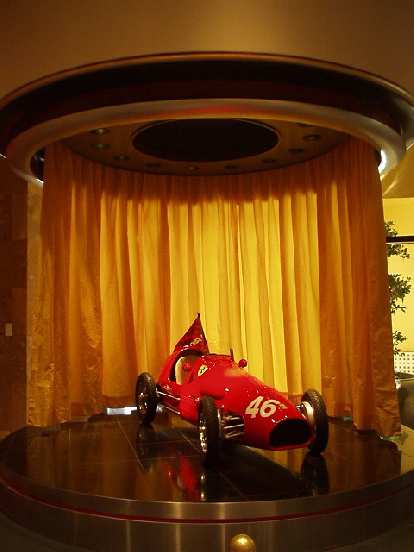 A scaled-down Ferrari race car.