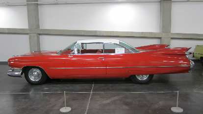 Cadillac Coupe with massive tailfins from the 1950s (a Henry Earl design).