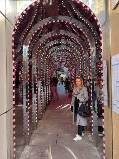 Andrea in a passage of mirrors a couple blocks west of the Covent Garden Underground Station.