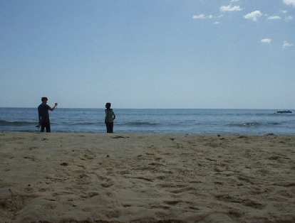 Taking photos on this scenic beach.