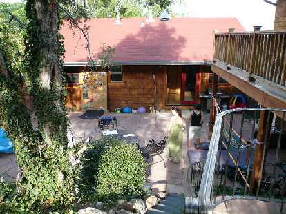 Lynn's back yard includes a bouldering wall for her four-year-old.