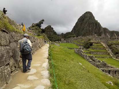 Tourist walking at Machu Picchu.