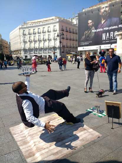 A "falling waiter" stunt at the Puerta del Sol. Netflix's Narcos drama was advertised all over Spain.