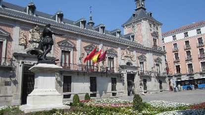 A statue and flags off Calle Mayor, west of la Plaza Mayor. A statue and flags off Calle Mayor, west of la Plaza Mayor.