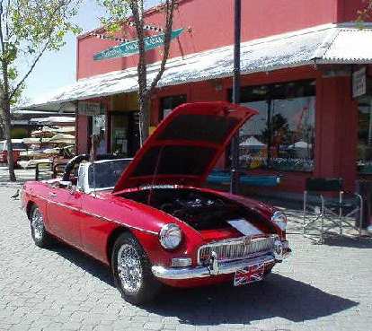 Red MGB in front of California Canoe & Kayak at Jack London Square.