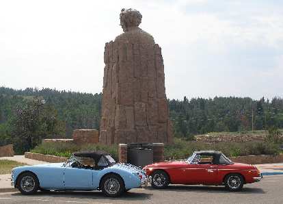 Mike Jacobsen's light blue MGA and Jennifer Orum's red 1970 MGB in front of the Abraham Lincoln Memorial Monument east of Laramie, Wyoming.