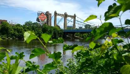 Grain Belt Beer sign by a bridge over the Mississippi River in Minneapolis.