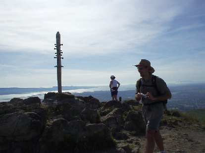 Made it to the top. Adrian laughs about something while Sharon looks down below. Made it to the top. Adrian laughs about something while Sharon looks down below.
