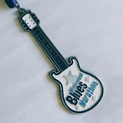 The medal for the 2019 Mississippi Blues Marathon was of a guitar.