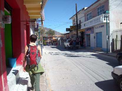 Sarah walking down the main street in Mitla.