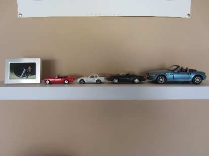The models of cars I had, now on a shelf in the garage. I still need one to represent Goldie, my 1969 pale primrose MGB. I also don't have an Audi TT model, but I have the real thing in the garage!