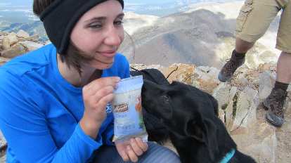 Diana showing Dani a bag of snacks.