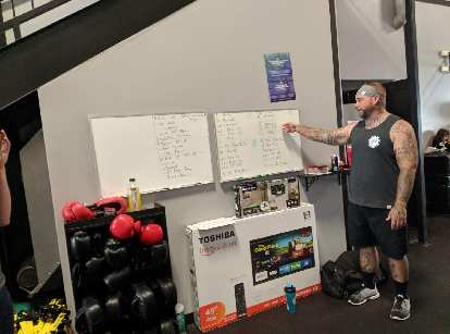 Zach breaking down the Murph Challenge's squats, push-ups, and pull-ups into sets.