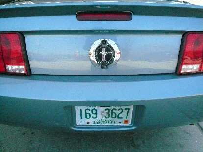 This mimicked the gas cap of the original and looked very good (it also houses the trunk lock). But the real gas cap is on the left side of the car.