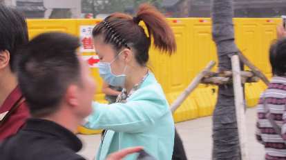 A young lady wearing a mask in Nanjing.