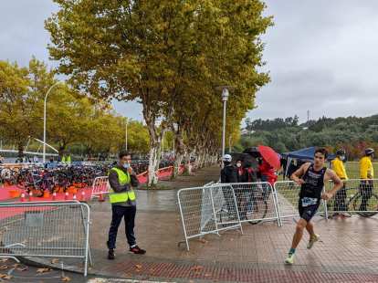 A triathlete rounding the final turn of the National Sprint Triathlon Championship in Spain.