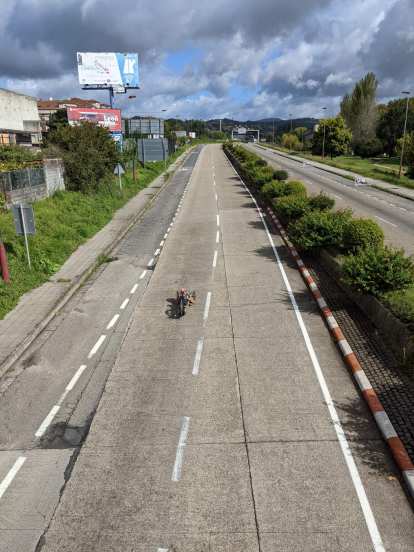 A handcycle triathlete cycling down Avenida Compostela, one of the main roads closed in Pontevedra for the National Sprint Triathlon Championship in Spain.