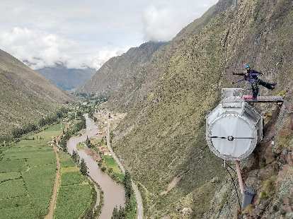 Two of the other Americans on top of their pod with the Sacred Valley below. (27 Nov 2018) Two of the other Americans on top of their pod with the Sacred Valley below.