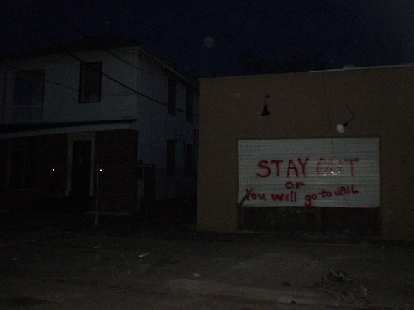 Along the same street as the hostel were homes boarded up declaring various things such as "Stay out or you will go to jail".