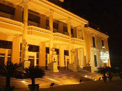 The theatre, at night.