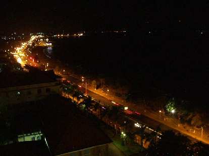Nighttime view of Nha Trang from the balcony of our room across from the beach.