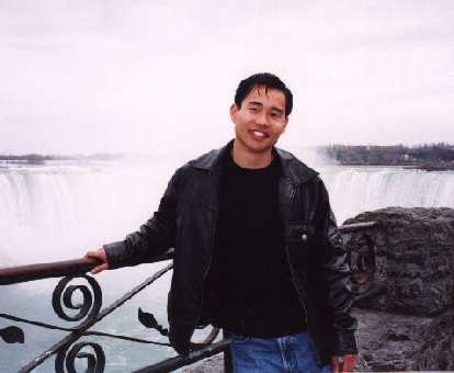 Felix Wong in front of the Falls, enjoying the view immensely.
