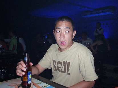 Nam drinking a beer in a discoteca in Nha Trang.