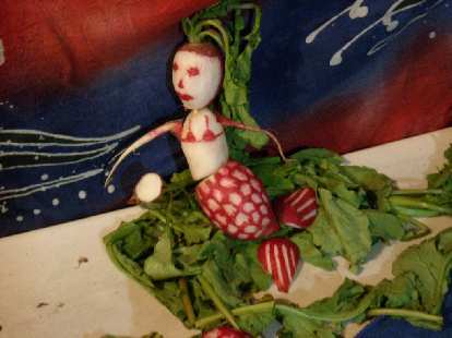 A mermaid radish carving. A mermaid radish carving.