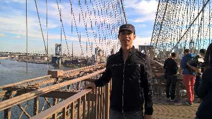 Felix Wong on the Brooklyn Bridge. Felix Wong on the Brooklyn Bridge.