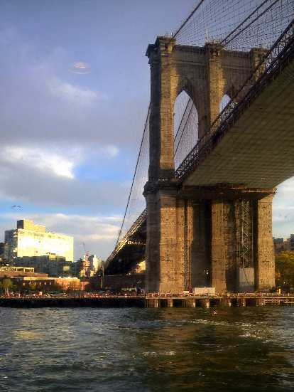 The Brooklyn Bridge as viewed from a ferry boat.