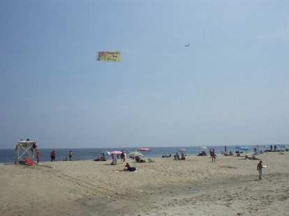 Amazingly, the beach at Sandy Hook was filled with... more commercialism. Many planes would fly on by with banners advertising stuff to the sunbathers. Amazingly, the beach at Sandy Hook was filled with... more commercialism. Many planes would fly on by with banners advertising stuff to the sunbathers.