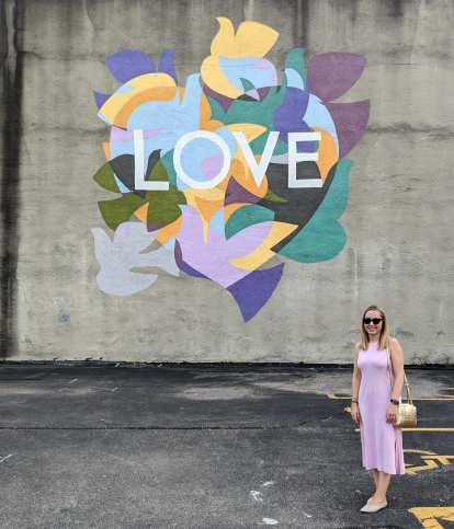 Andrea in front of a LOVE mural in downtown Dayton, Ohio.