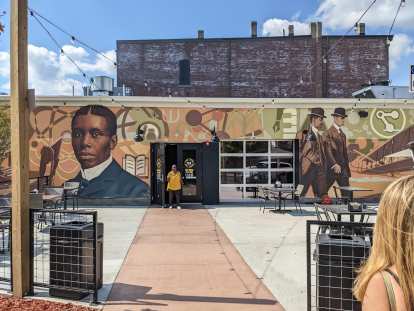 A mural at an indoor food court across the street from Dayton Aviation Heritage National Historical Park featuring poet Paul Laurence Dumbar and the Wright brothers.