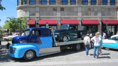 blue two-tone vintage tow truck, green vintage Ford pickup truck