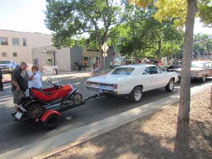 A Chevrolet Chevelle towing a pedal car. A Chevrolet Chevelle towing a pedal car.