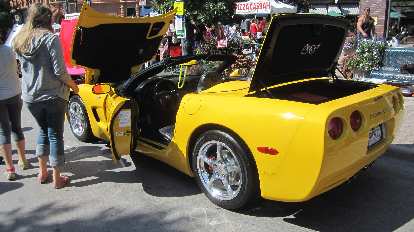 Yellow C5 Corvette convertible.