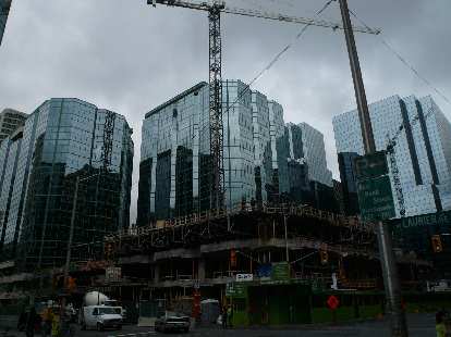Construction of modern glass high-rise buildings in Ottawa.