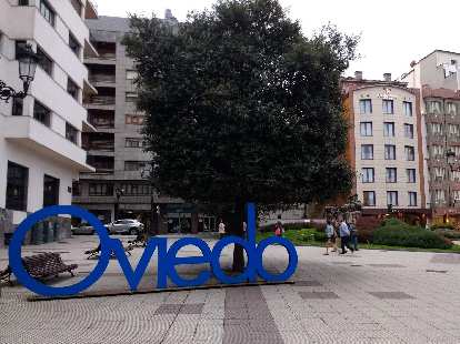 Blue Oviedo sign at Plaza Carbayón in central Oviedo.